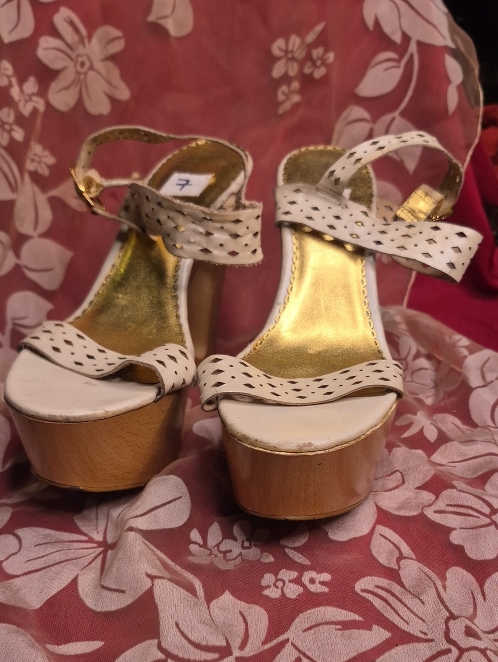Bebe Womenโs White Perforated Platform Wedge Wood Sandals with Gold Insole